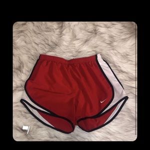 Red Nike running shorts